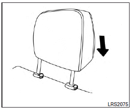 1. Align the head restraint stalks with the holes in the seat. Make sure the head restraint is facing the correct direction.