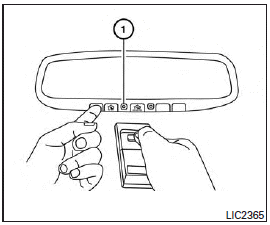 2. Using both hands, simultaneously press and hold the desired HomeLink button and handheld transmitter button. DO NOT release until the HomeLink indicator light flashes 1 slowly and then rapidly. When the indicator light flashes rapidly, both buttons may be released. (The rapid flashing indicates successful training.)